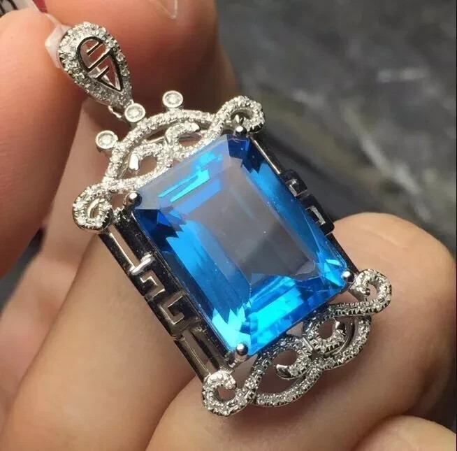 4Ct Emerald Cut London Blue Topaz Pendant in 14K White Gold Finish